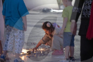 Lighting Candles To Mark The Memory Of War Victims