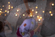 Lighting Candles To Mark The Memory Of War Victims