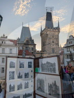 Tourists And Street Artists On Charles Bridge In Prague