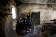 Freed Israeli hostage revisits her charred home