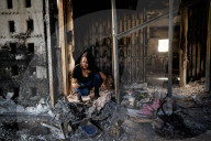 Freed Israeli hostage revisits her charred home