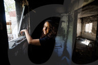 Freed Israeli hostage revisits her charred home