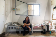 Freed Israeli hostage revisits her charred home