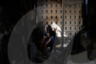 Freed Israeli hostage revisits her charred home