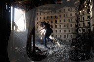 Freed Israeli hostage revisits her charred home