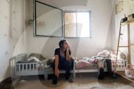 Freed Israeli hostage revisits her charred home