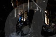 Freed Israeli hostage revisits her charred home