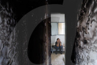 Freed Israeli hostage revisits her charred home