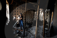 Freed Israeli hostage revisits her charred home