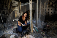 Freed Israeli hostage revisits her charred home