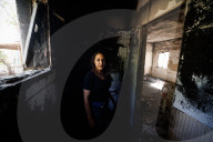Freed Israeli hostage revisits her charred home