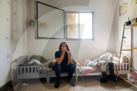 Freed Israeli hostage revisits her charred home