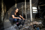 Freed Israeli hostage revisits her charred home
