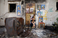 Freed Israeli hostage revisits her charred home