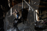 Freed Israeli hostage revisits her charred home