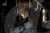 Freed Israeli hostage revisits her charred home