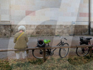 Senior Woman Cyclist Sitting Outdoors