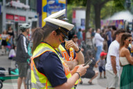 Police Officer At Pride Parade Wears A Pride Rainbow Water Tattoo On Cheek
