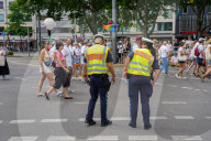 Police Officer At Pride Parade Wears A Pride Rainbow Water Tattoo On Cheek