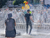 People Cooling Off In Fountain At Munich Karlsplatz Stachus During Heatwave