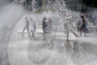People Cooling Off In Fountain At Munich Karlsplatz Stachus During Heatwave