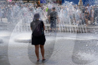 People Cooling Off In Fountain At Munich Karlsplatz Stachus During Heatwave