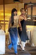 *PREMIUM-EXCLUSIVE* *MUST CALL FOR PRICING* - Newly single Dakota Johnson beams with surprise alongside Kate Hudson as pop icon Ricky Martin makes an unexpected appearance during an evening out at the iconic Pierluigi restaurant
