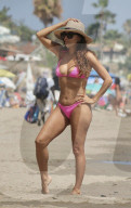 *PREMIUM-EXCLUSIVE* *MUST CALL FOR PRICING* 'Stunning and Supportive' Eva Longoria tenderly helps husband José Bastón adjust his sling before sharing a kiss during a family beach day in Marbella