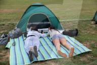 Tennis fans queue for Wimbledon tickets in London, UK.