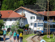 Family Hikers At Hammersbach Train Station In The Bavarian Alps