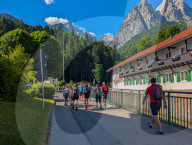 Hikers Set Off On A Day Trip In The Bavarian Alps