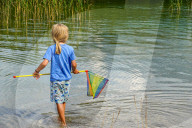 Playing At Lake With Fishing Net