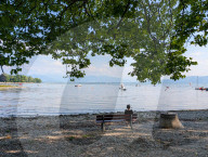 People Sitting Alone By A Lake