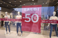 Summer Sale Sign Displayed In A Storefront Window In Italy