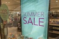Summer Sale Sign Displayed In A Storefront Window In Italy