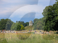 People Relaxing In The English Garden In Munich