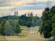 People Relaxing In The English Garden In Munich