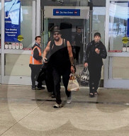 PREMIUM EXCLUSIVE  Jason Momoa Arrives at LAX with Son and Injured Daughter While Looking Ripped