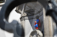 Superman costume on Manneken Pis for film premiere in Brussels, Belgium.