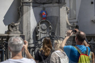 Superman costume on Manneken Pis for film premiere in Brussels, Belgium.