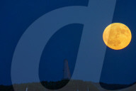 Full Buck Moon Rises Behind Torre del Serpe in Otranto, Italy