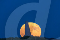 Full Buck Moon Rises Behind Torre del Serpe in Otranto, Italy