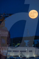 Full Buck Moon Rises Behind Torre del Serpe in Otranto, Italy