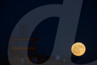 Full Buck Moon Rises Behind Torre del Serpe in Otranto, Italy