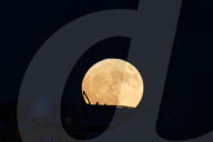 Full Buck Moon Rises Behind Torre del Serpe in Otranto, Italy
