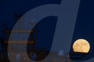 Full Buck Moon Rises Behind Torre del Serpe in Otranto, Italy