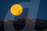 Full Buck Moon Sets Behind Rocca Calascio, Italy