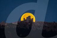 Full Buck Moon Sets Behind Rocca Calascio, Italy