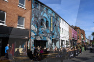 Oasis fever grips Manchester before reunion gigs.