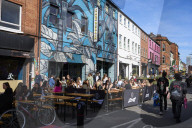 Oasis fever grips Manchester before reunion gigs.